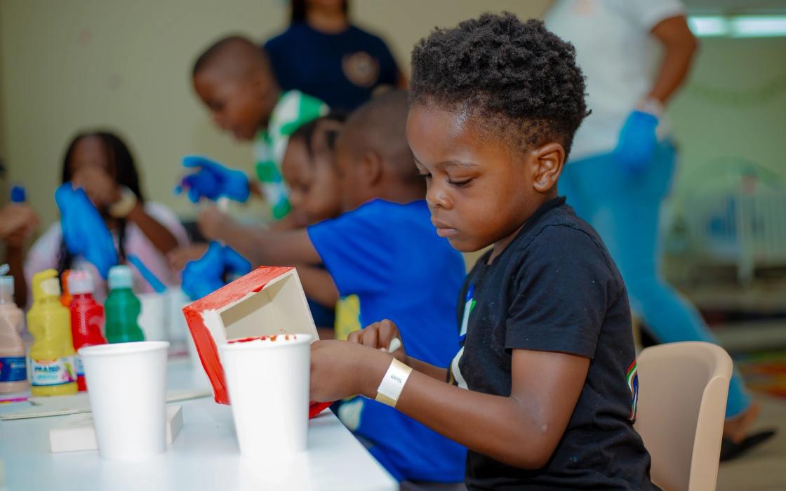 A boy working on a craft project