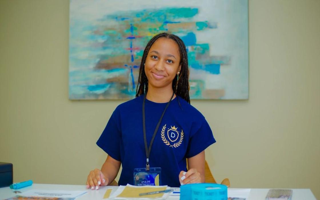 A teacher preparing a learning activity at her table