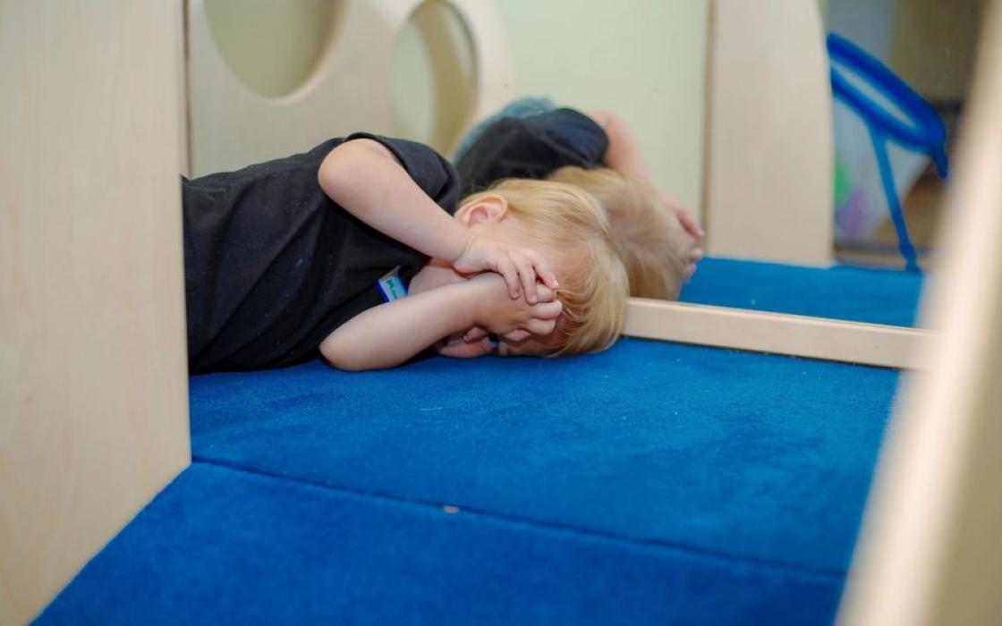 A child resting quietly during afternoon rest time